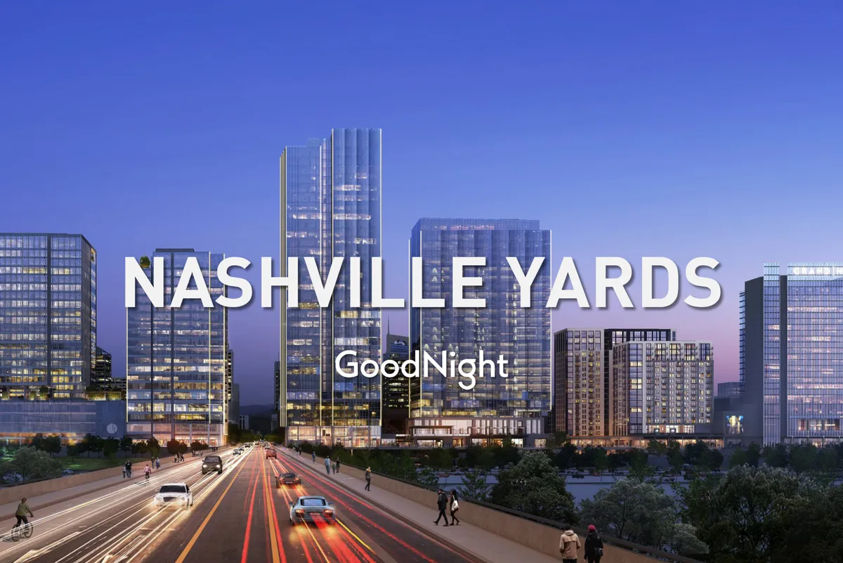This image captures the vibrant Nashville city skyline at dusk, with illuminated skyscrapers, a lively street scene, and the bustle of city life. The view conveys the energetic atmosphere of the downtown core, hinting at the nightlife and entertainment options that await after dark.