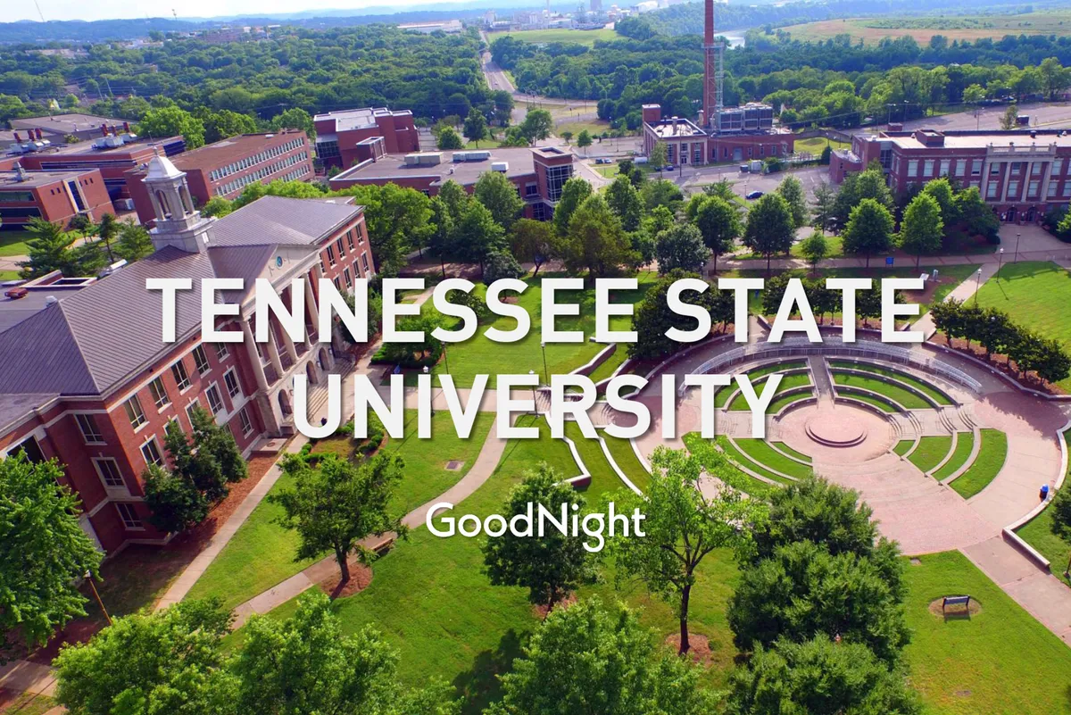 A lively perspective of Tennessee State University's main buildings and central circular plaza, surrounded by mature trees and open green spaces. The scene pulses with campus life and energy.